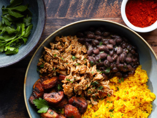 Datcha French Caribbean Bowl – Founders’ Food Hall Charlottetown French Caribbean rice bowl with shredded chicken, black beans, plantains, and yellow rice from Datcha at Founders’ Food Hall in Charlottetown