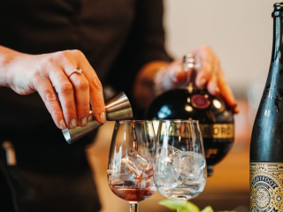 Craft Cocktails at Notables – Founders’ Food Hall Charlottetown Staff member preparing tasting cocktails with Chambord and sparkling wine at Notables in Founders’ Food Hall, Charlottetown