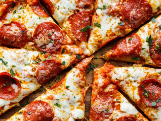 Ollie’s Pepperoni Pizza – Fresh, Local & Baked in Charlottetown Close-up of pepperoni pizza from Ollie’s in Charlottetown, topped with melted cheese, tomato sauce, and fresh herbs