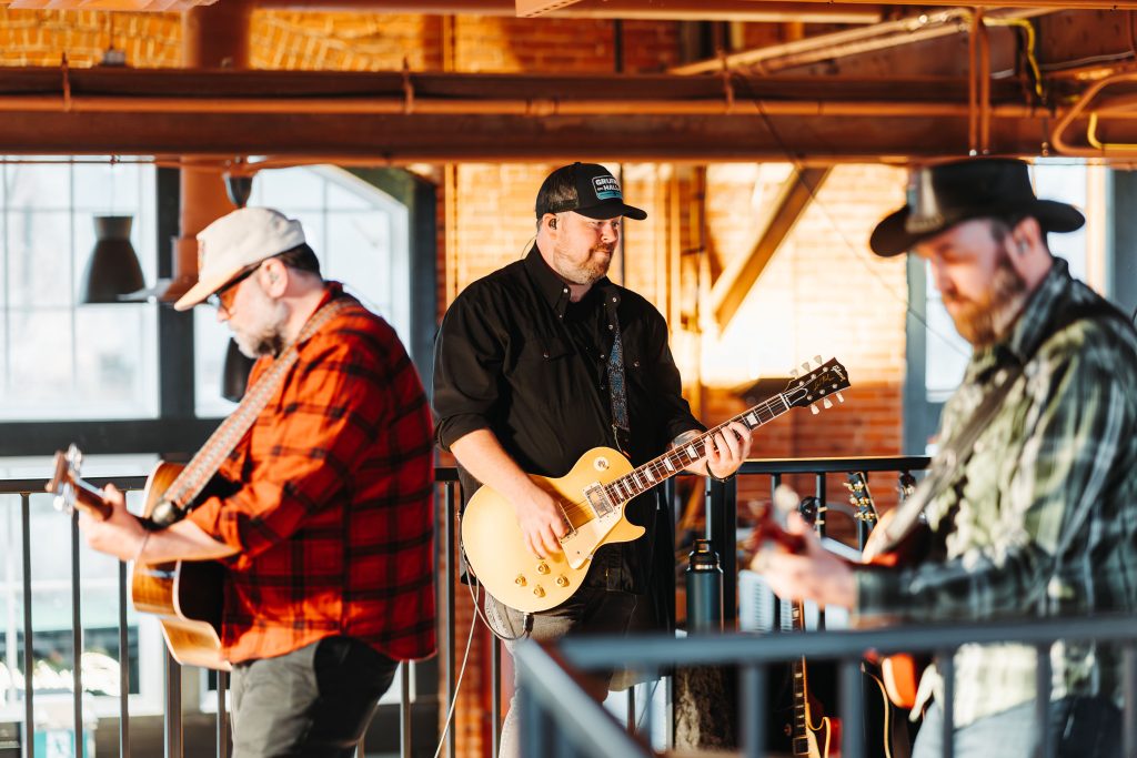 Local musicians performing live music inside Founders Food Hall in Charlottetown Prince Edward Island