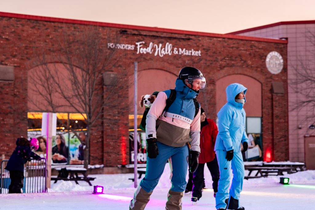 Skaters enjoying Glow Skate at Founders Food Hall & Market in Charlottetown PEI during winter